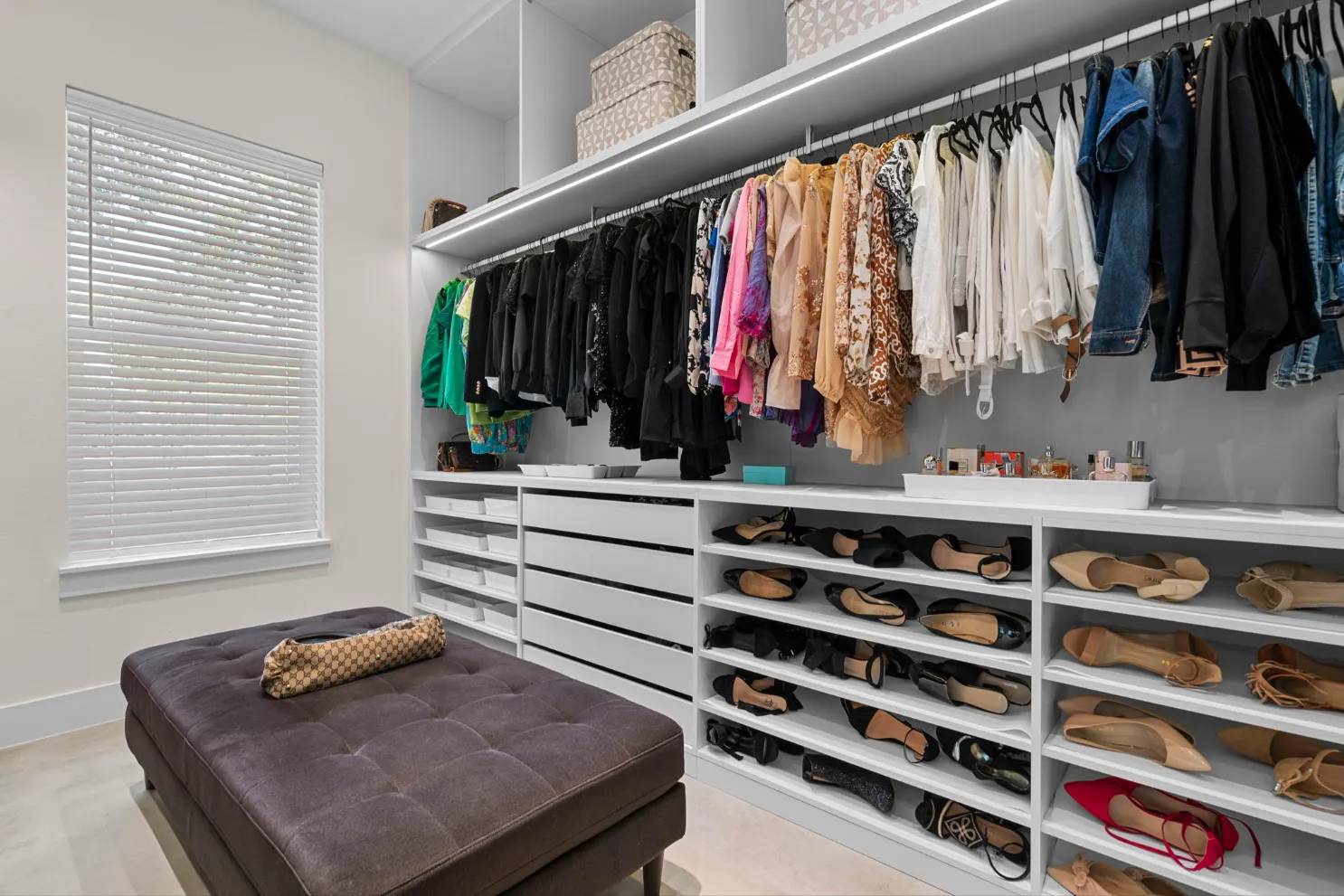 A walk-in closet built and installed by Click Closets