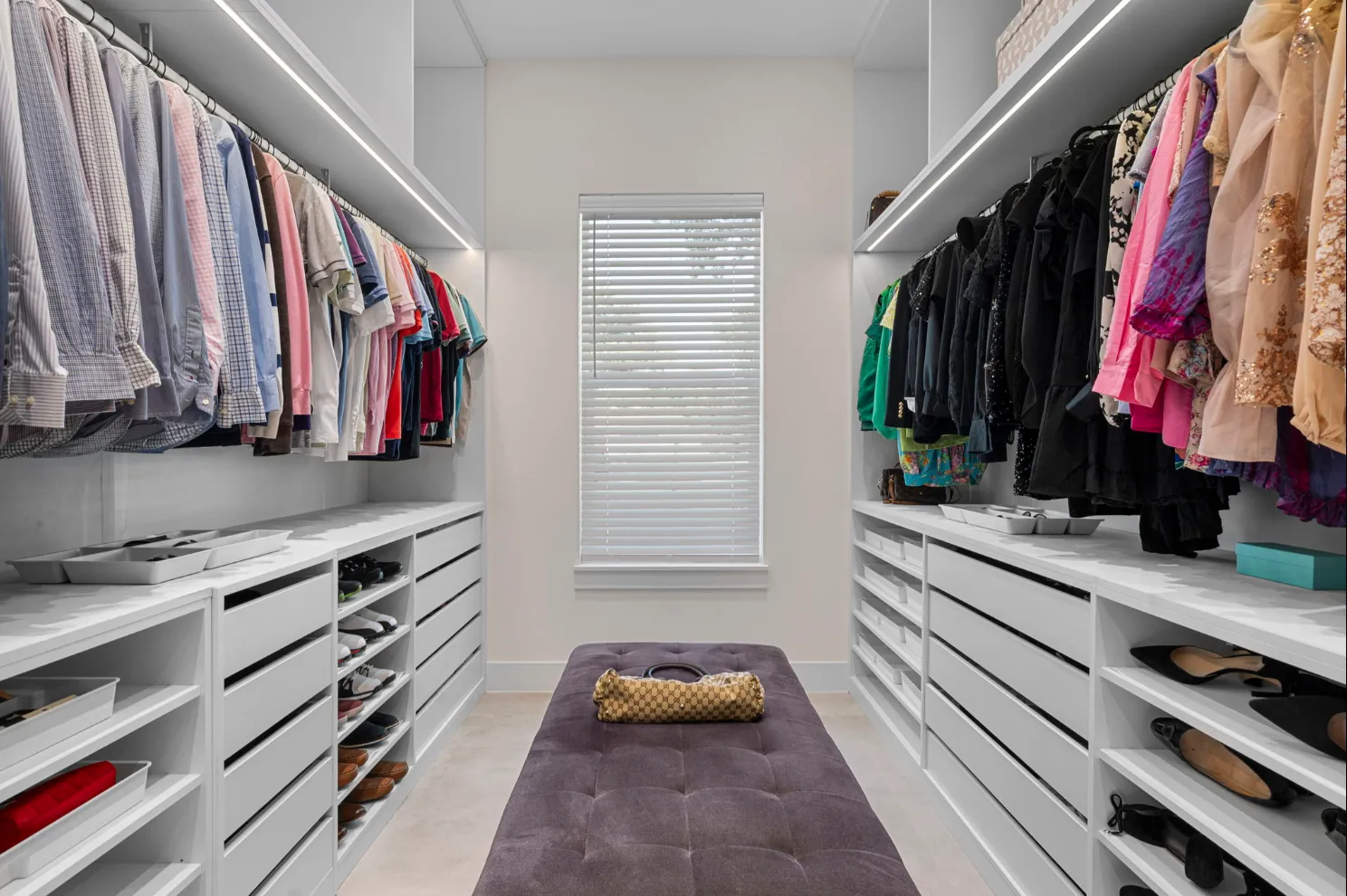 A walk-in closet built and installed by Click Closets